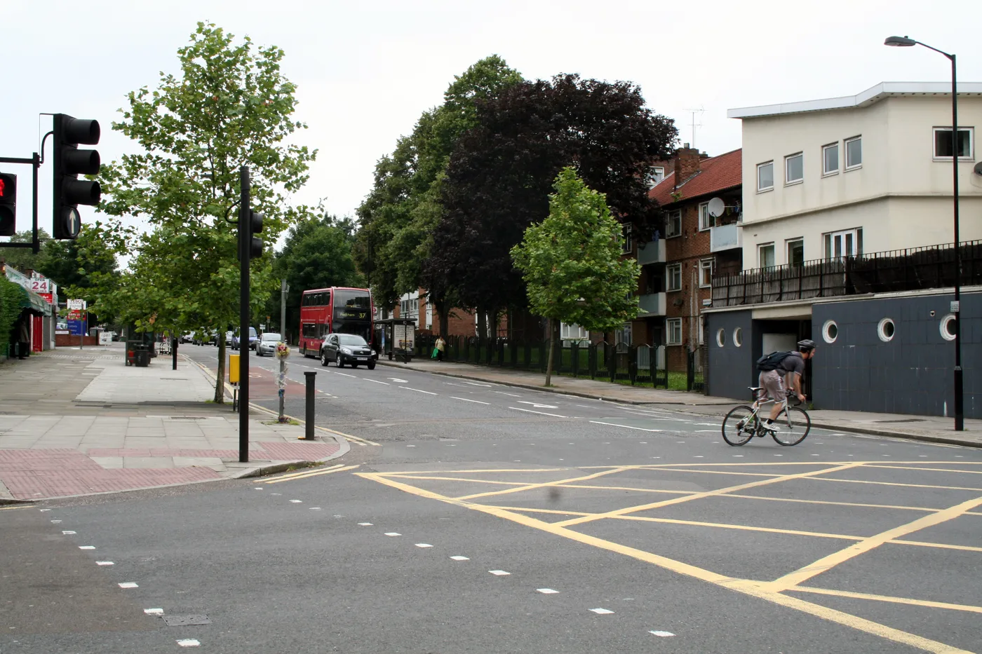 East Dulwich Road in Peckham, one of the roads in the scheme. A route 37 bus and a cyclist share the carriageway at the junction