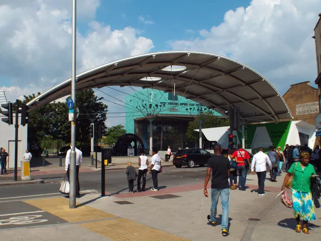 The Peckham Arch, with Peckham Library behind it across Peckham High Street, in August 2013